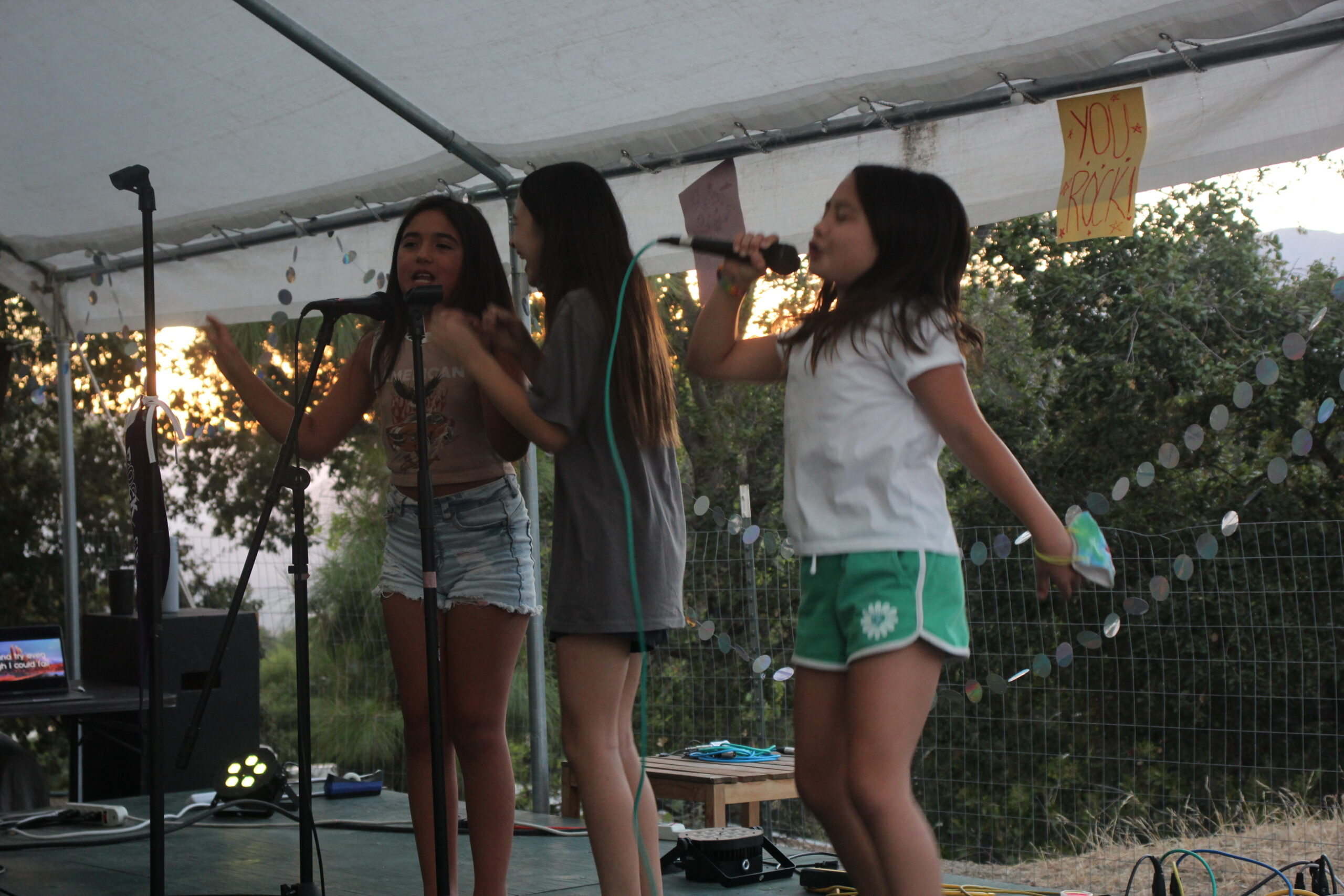girls on stage singing