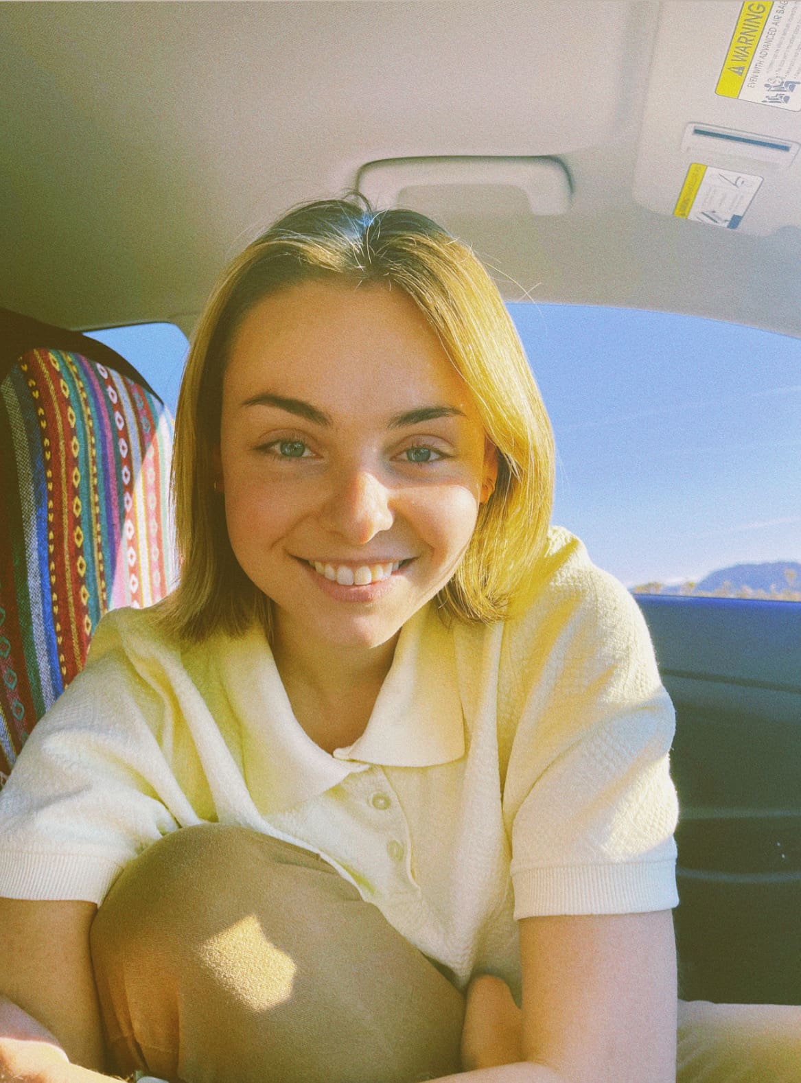 girl with blonde hair smiling